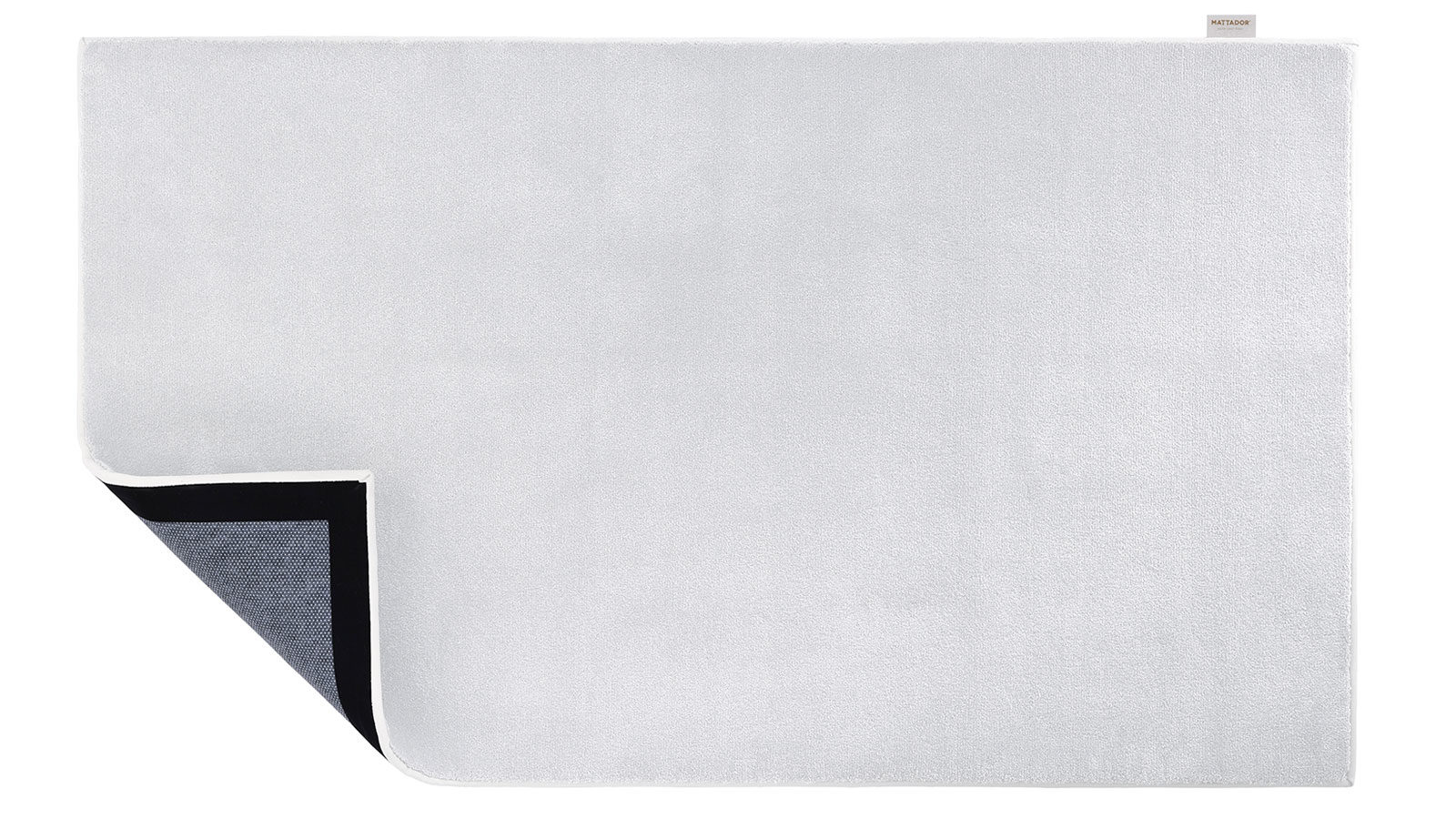 Bovenaanzicht van Tuxedo wit vloerkleed met in de hoek zicht op onderzijde